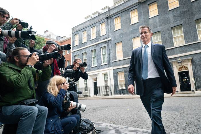 Jeremy Hunt leaving Downing Street on Friday after being appointed chancellor