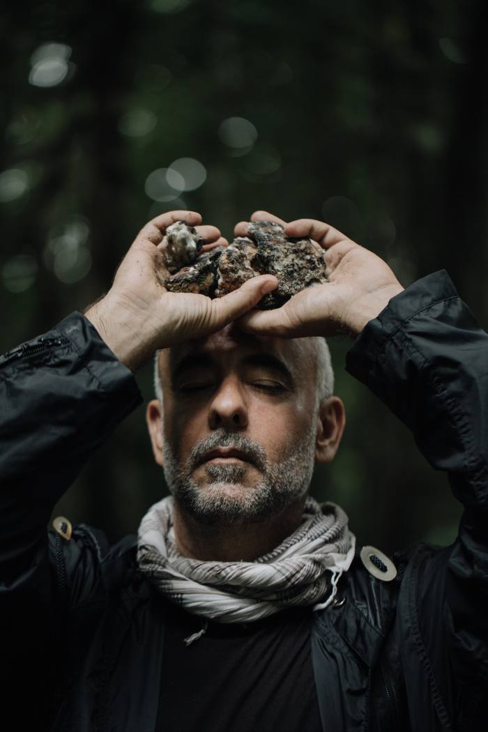 Costa with handfuls of Breu, the smell of which he describes as' something I'd never experienced before: masculine, feminine;  easy, complicated;  deep and foresty but also not '