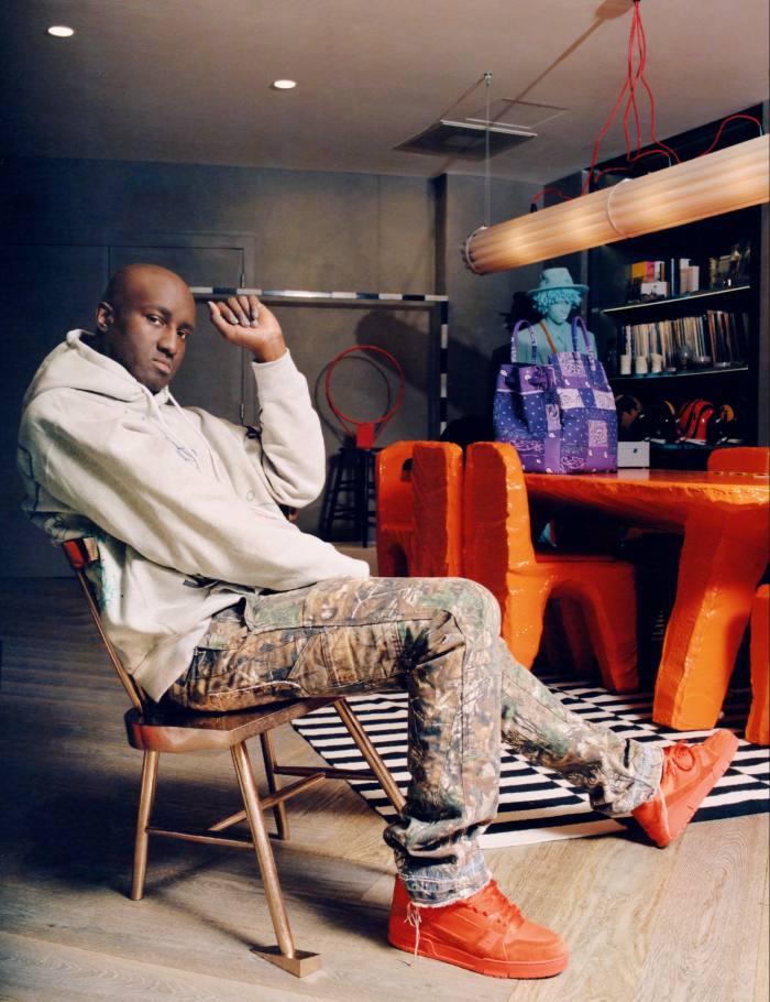 Virgil Abloh photographed in his Paris studio, sitting on the bronze Alaska chair from his 2019 Acqua Alta collection