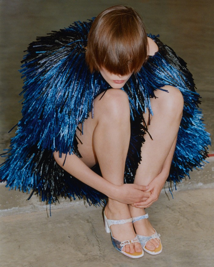 Alexander McQueen viscose Ottoman-knit and raffia-fringed dress, POA. Vintage shoes, handpainted by John Hurley