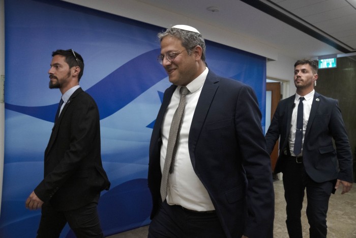 Israel’s minister of national security Itamar Ben-Gvir, flanked by his security detai