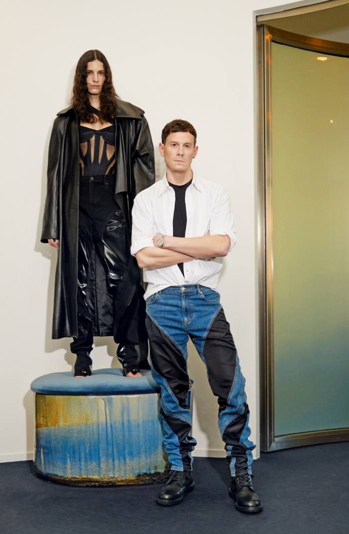 Casey Cadwallader, creative director of Mugler, with model and friend of the house Cyrielle Lalande, wearing Mugler leather trench coat, POA, corset top, £1,960, Spiral trousers, £580, and Mugler x Jimmy Choo shoes, £1,425