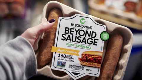 Person holds package of Beyond Meat sausages