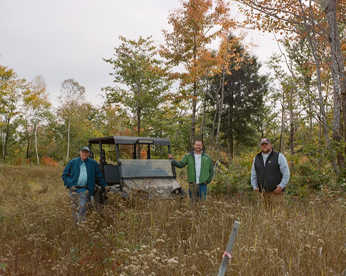 From left: Morrill Worcester with his two sons, Rob and Mike, at the future site of the flagpole