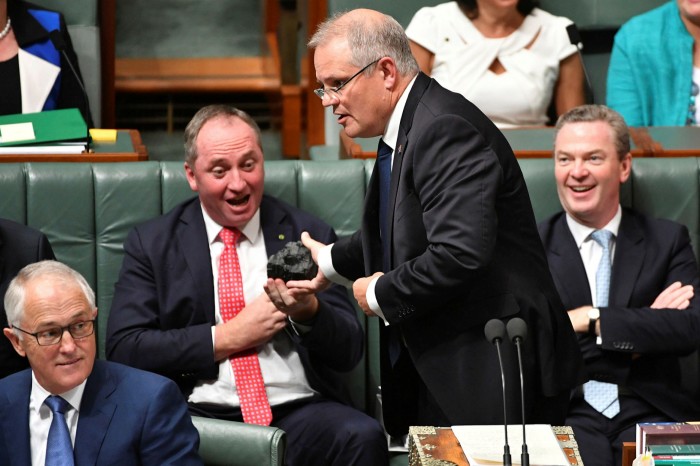 Scott Morrison hands deputy prime minister Barnaby Joyce a lump of coal in the House of Representatives in 2017