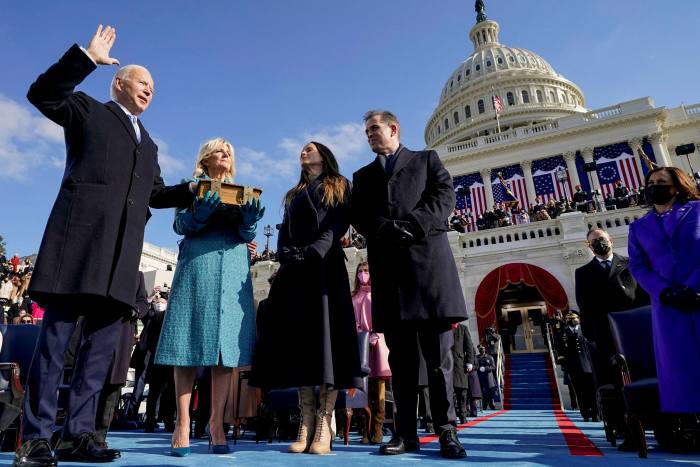Joe Biden, left, is sworn in as US president in Washington on Wednesday