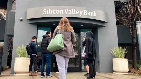 People stand outside the Silicon Valley Bank in California