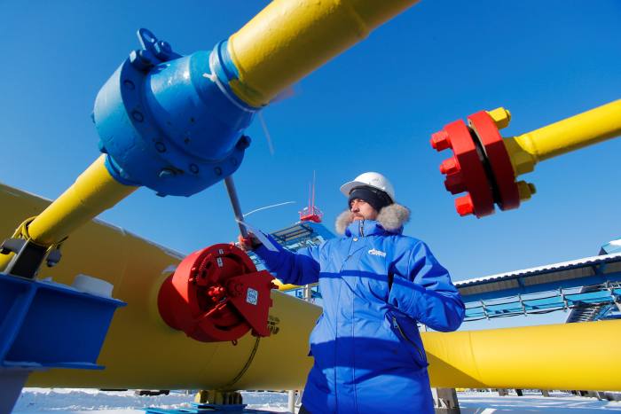 An employee checks a gas valve at the Atamanskaya compressor station, part of Gazprom’s Power Of Siberia gas pipeline outside the far eastern town of Svobodny, in Amur region, Russia