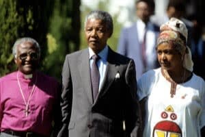 Tutu with Nelson Mandela and his then wife, Winnie, at Tutu’s official Cape Town residence on the day after Mandela’s release from jail in 1990
