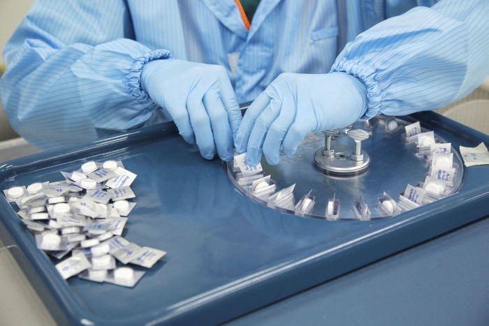 A worker packs paracetamol tablets at a lab in Singapore. Surges in Covid-19 hospitalisations and the resulting rationing of simpler drugs exposed how little governments knew about medical supply chains
