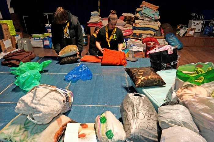 Polish scouts sort items donated for Ukrainian refugees