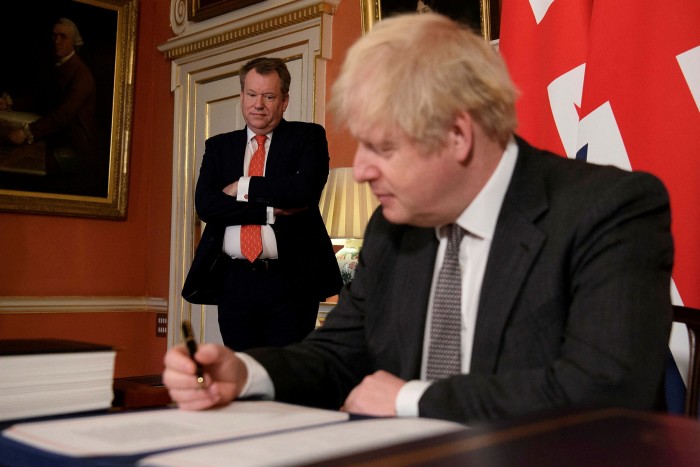 David Frost looks on as Boris Johnson signs the EU-UK trade deal in 2020. The prime minister has ordered his chief negotiator to return to the table to try to resolve the Northern Ireland dispute