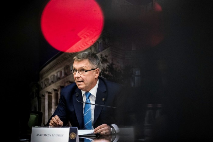 Gyorgy Matolcsy, governor of Hungary’s central bank, sits at a desk during an interest rates decision briefing 