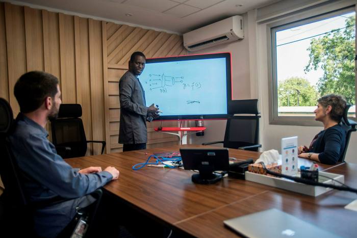 Moustapha Cisse, head of the Google Artificial Intelligence centre in Ghana, with his team. Google is due to finish the first phase of a subsea internet cable running from Lisbon to Cape Town this year