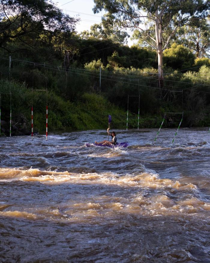 A kayaker riding the rapids on the Yarra at Westerfolds Park