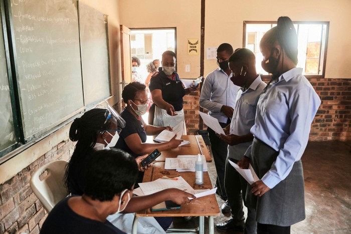 Health workers register the details of students during a rural vaccination drive by the Broadreach NGO at Duduzile secondary school in Mpumalanga, South Africa
