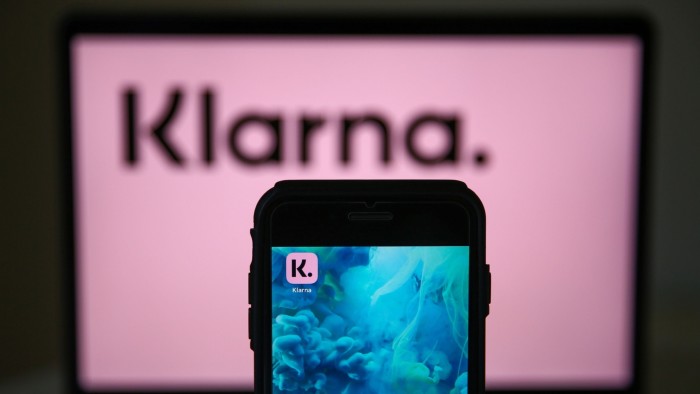 Klarna's losses halve as Swedish fintech predicts return to profit