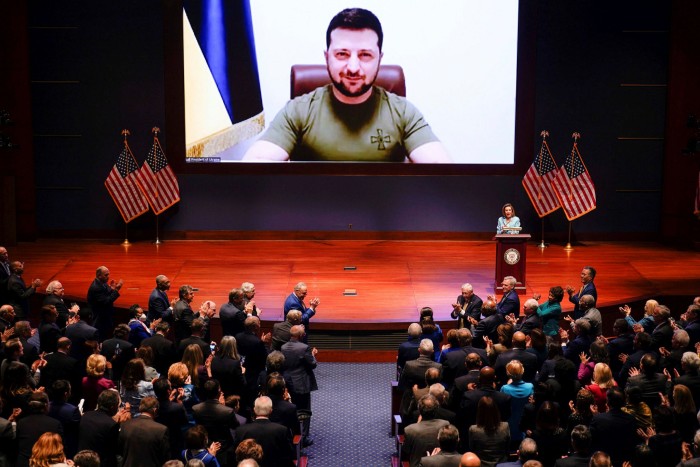 Volodymyr Zelensky, pictured on a screen, addressing the US Congress