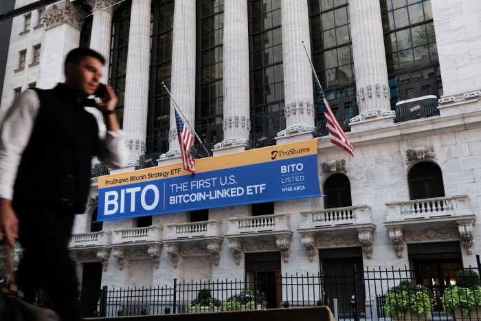 A banner for the newly listed ProShares Bitcoin Strategy ETF hangs outside the New York Stock Exchange