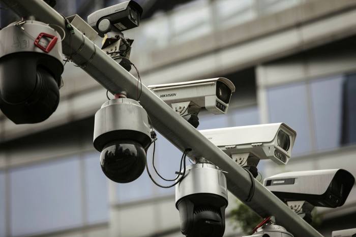 Surveillance cameras made by Hangzhou Hikvision Digital Technology are mounted on a post at a testing station near the company’s headquarters in Hangzhou, China