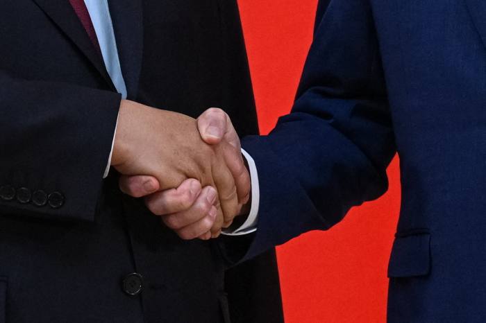 close-up shot of two people shaking hands