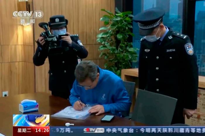 Chinese police perform law enforcement work during a raid on a Capvision office in Shanghai