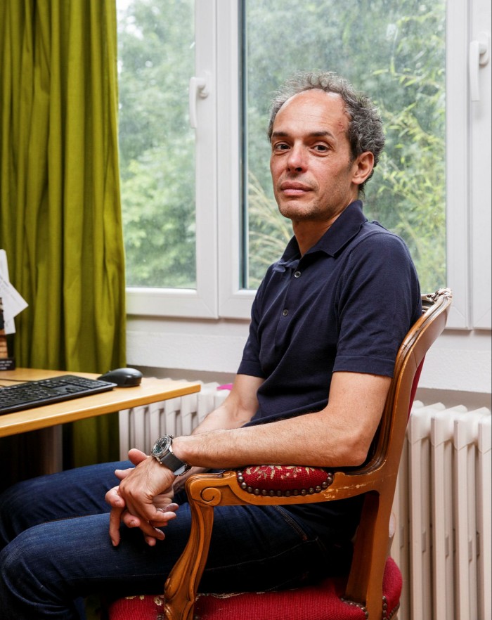 Davide Uglietti poses for a portrait in his home in Brugg, Switzerland.