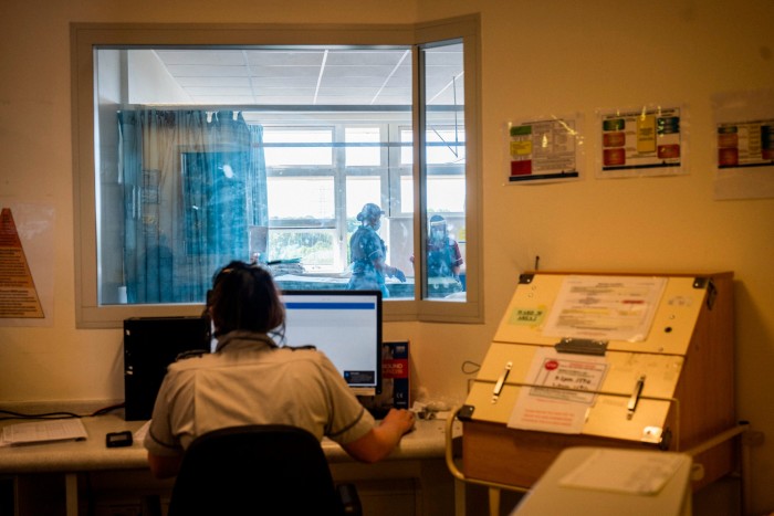 A nurse looks into a specially designated Covid ward in Coventry, UK