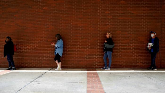 People who lost their jobs wait in line to file for unemployment benefits in Fort Smith, Arkansas, US.