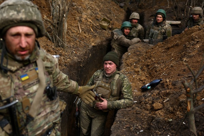 Ukrainian service members in their trenches in the Bakhmut region