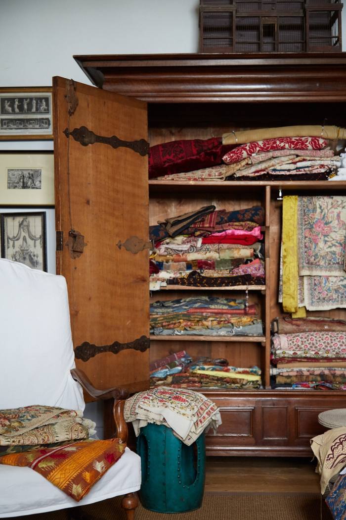 Fabrics piled in the cupboard of Copping’s office