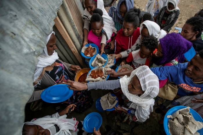 Displaced Tigrayans queue for food at a reception centre for the internally displaced in Mekele, northern Ethiopia