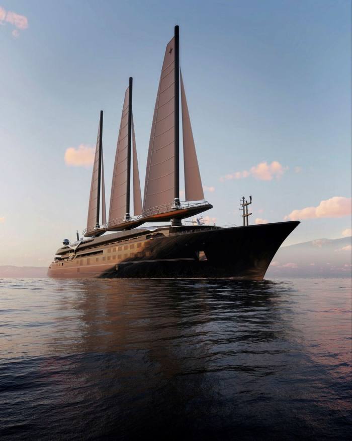 A large, three-sailed yacht takes to the water