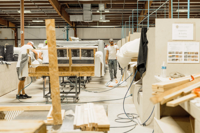 Staff working at an upholstery warehouse in Mississippi, US in July 2022