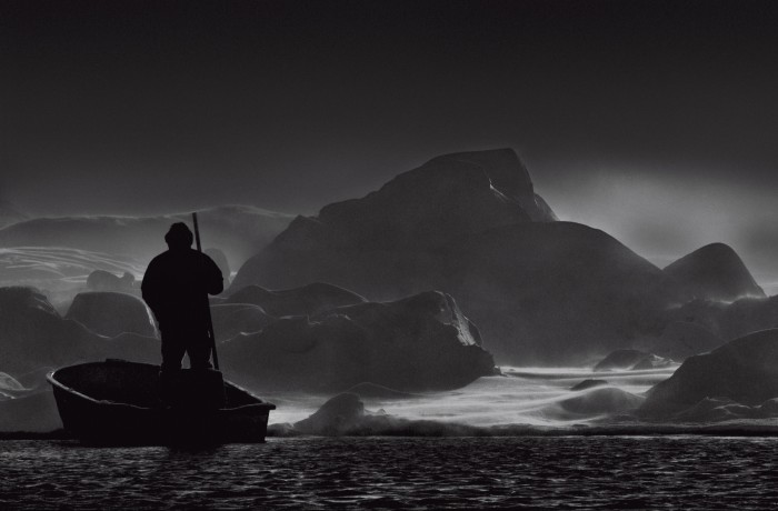 A hunter on his boat on Sermilik fjord, east Greenland, 2015