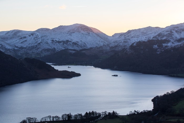 Lake Ullswater in winter, surrounded by hills