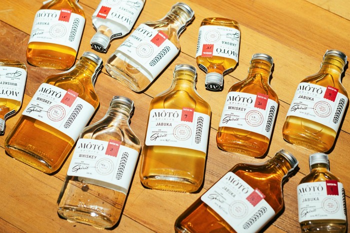 Bottles of rice whiskey and Jabuka, an apple-based drink, at Moto Spirits
