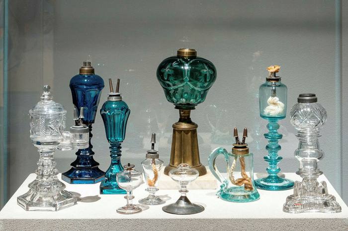 Ornate lamps in clear, blue and green glass