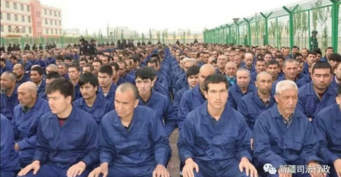 Uyghur detainees listening to a ‘de-radicalisation’ speech at a re-education camp in Hotan prefecture’s Lop county