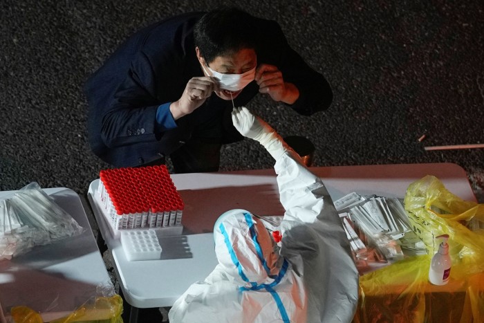 A man undergoes a coronavirus test