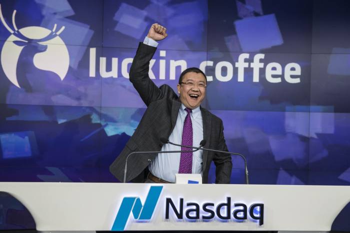 Charles Zhengyao Lu, founder of Luckin Coffee, celebrates during the company's US initial public offering in 2019 