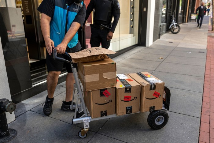 An Amazon courier delivering packages in San Francisco, USA