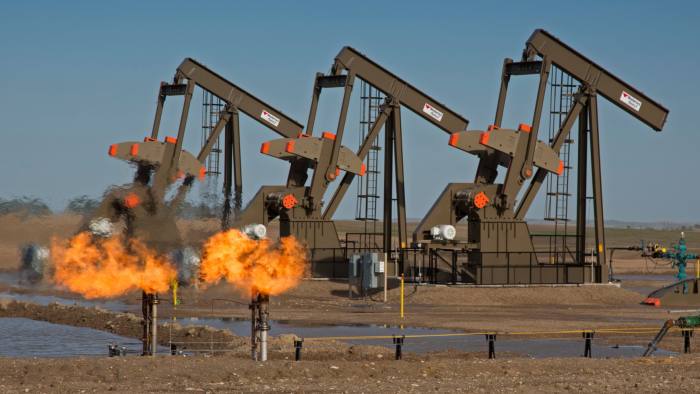 Natural gas flares as oil is pumped in the Bakken shale formation