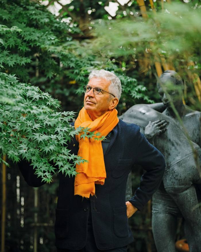 In his garden, wearing his orange scarf