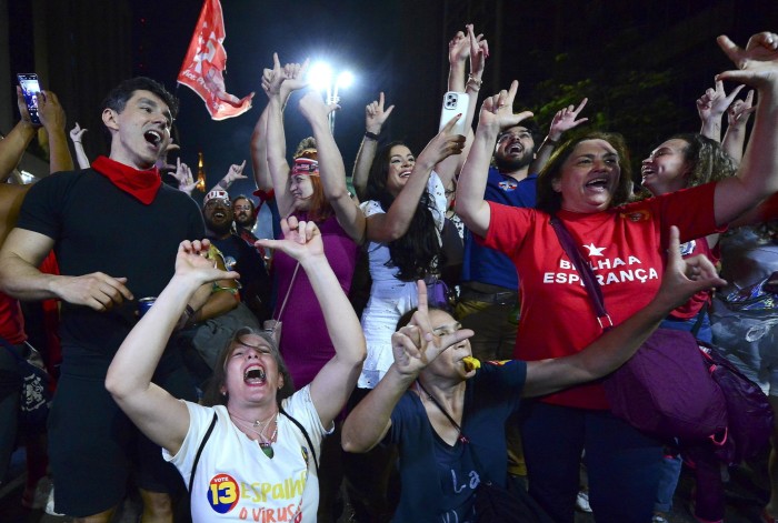Supporters of Luiz Inácio Lula da Silva in São Paulo cheer on Sunday