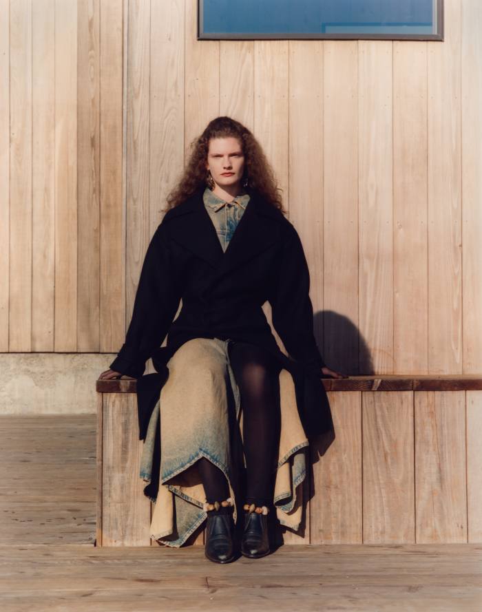 Saint Laurent by Anthony Vaccarello cashmere-mix coat, £3,985, and fishnet gloves, £460. Y/Project denim dress, €895. Lisa Eisner polished bronze and crystal earrings, $2,200. Ulla Johnson ankle bracelets, POA. Vintage boots, stylist’s own 