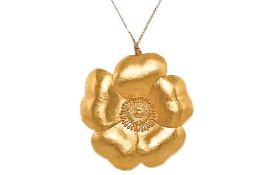 A golden pendant in the shape of a flower