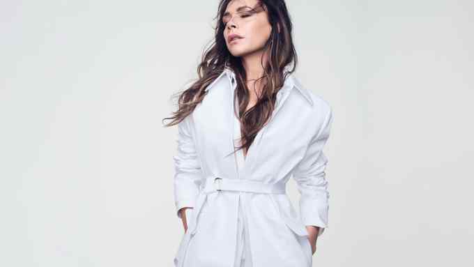 Victoria Beckham wears Valentino compact cotton poplin belted jacket, £2,450, matching shirt, £1,380, and matching miniskirt, £780