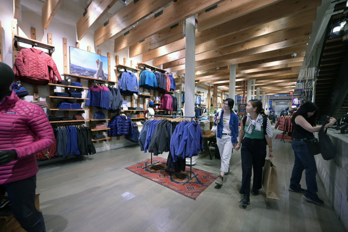 Down and fleece jackets and other merchandise on display inside the Patagonia outdoor clothing store
