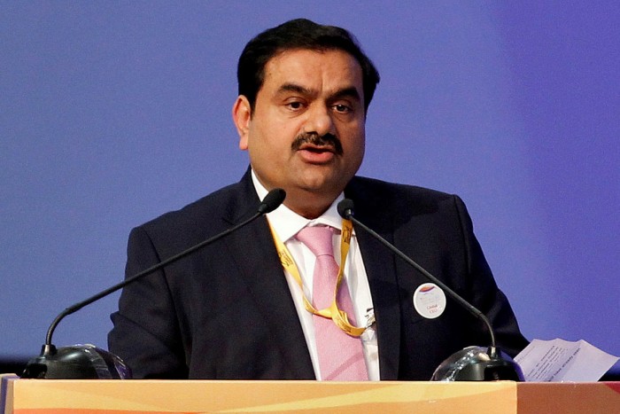 A picture of Gautam Adani wearing a pink tie